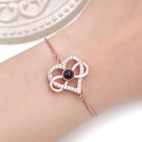 Miniatura 2 de Pulsera ajustable de cadena de plata/oro rosa, 4 dijes de corazón diferentes en 100 idiomas con texto en inglés "Say I Love You", pulsera