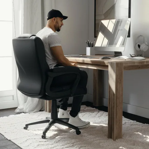 Miniatura 7 de Flash Furniture Fundamentals - Silla giratoria grande y alta de LeatherSoft para oficina y juegos, silla de oficina ergonómica con reposabrazos Negro
