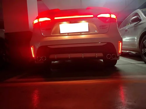 Miniatura 8 de iJDMTOY Luces reflectoras de parachoques LED de lente roja compatibles con Toyota Corolla Sedán 2019-22, funciona como faros antiniebla traseros