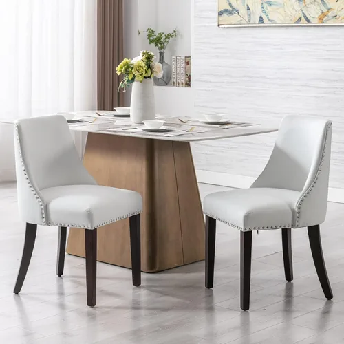 Juego de 2 sillas de comedor tapizadas de mediados de siglo con adornos de cabeza de clavo con cojín de piel sintética y patas de madera para sala