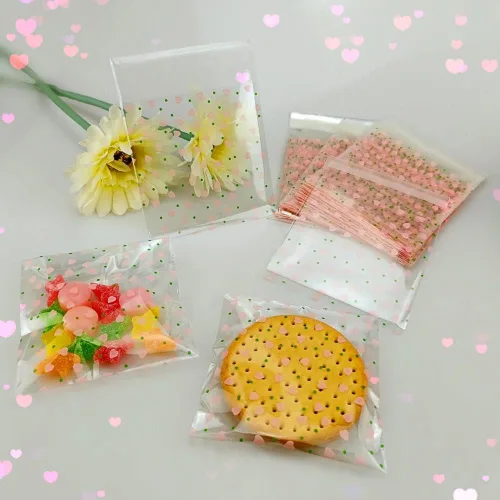 Miniatura 5 de 100 bolsas de celofán transparente con corazón rosa de San Valentín para suministros de panadería