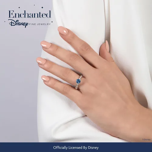 Miniatura 2 de Jewelili Enchanted Disney Fine Jewelry - Anillo de plata de ley con diamante de 1/5 quilates y topacio azul londinense