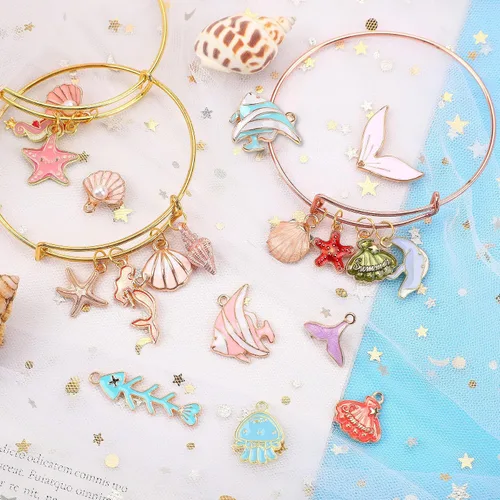 Miniatura 5 de MARFOREVER 120 dijes de mar con temática oceánica para la fabricación de joyas, esmalte dorado surtido de estrellas de mar y conchas marinas