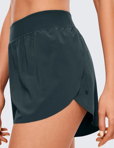 Miniatura 3 de CRZ YOGA Pantalones cortos deportivos de cintura media Dolphin para mujer, ligeros, con abertura alta, para gimnasio, entrenamiento, con forro