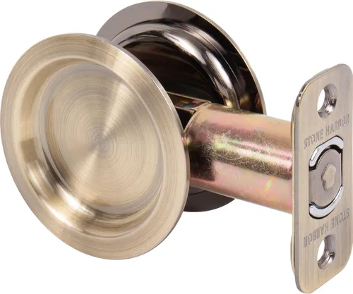 Cerradura de puerta de bolsillo redondo, pasaje (pasillo/armario) pestillo, 2.7 in fondo, RCL, latón antiguo por Stone Harbor Hardware