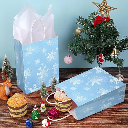 Miniatura 4 de Jectivs Paquete de 24 bolsas de regalo para fiestas, bolsas grandes y gruesas de papel kraft blanco con copos de nieve azul hielo con tejido blanco