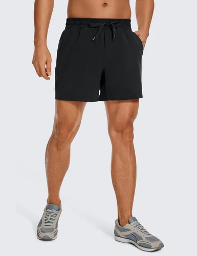 Miniatura 3 de CRZ YOGA Pantalones cortos de entrenamiento sin forro para hombre, ligeros, de secado rápido, para correr, deportes, gimnasio, con bolsillos