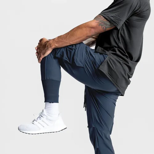 Miniatura 6 de Pantalones de entrenamiento ligeros para hombre con bolsillos con cremallera
