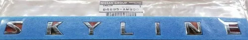 Miniatura 5 de NISSAN Emblema de pieza genuina Tapa de maletero Primera 4D Número de pieza 84890-50J60