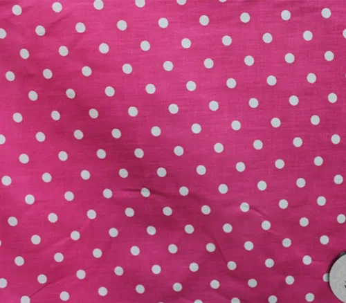 Tela de polialgodón con estampado de lunares pequeños, fondo blanco y rosa intenso/60 pulgadas de ancho/vendido por The Yard