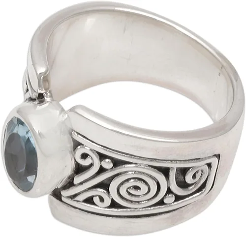 Miniatura 4 de NOVICA Anillo artesanal hecho a mano con topacio azul de una sola piedra de ley .925 ancho con piedra natal de serenidad de Indonesia 'Blue Karma