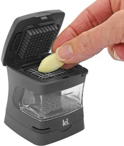 Miniatura 7 de Prensa de ajo Garlic-A-Peel, trituradora, cortadora, picadora y contenedor de almacenamiento - Incluye pelador de ajo de silicona - Fácil de limpiar