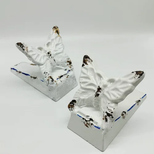 Paquete de 2 topes de puerta de hierro fundido, bonitos topes decorativos de mariposa para puerta, colección vintage de granja, cuña de tope de