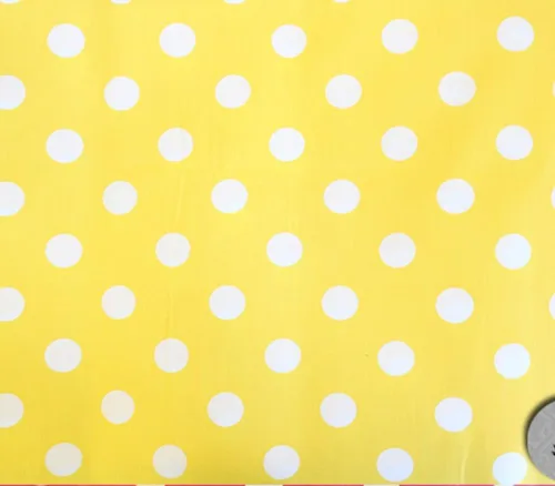 Tela de polialgodón con estampado de lunares blanco y fondo amarillo / 60 pulgadas de ancho/vendido por The Yard