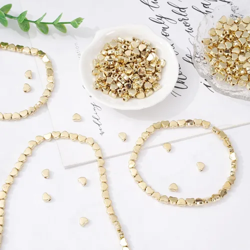 Miniatura 5 de Whaline 600 cuentas acrílicas doradas en forma de corazón con cuerda elástica para hacer joyas, bricolaje y decoración del hogar Dorado