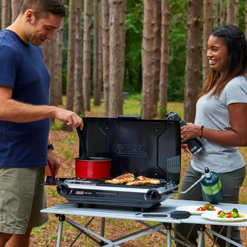 Miniatura 4 de Coleman Parrilla/estufa de campamento 2 en 1 de mesa, parrilla y estufa de propano de 2 quemadores con quemadores ajustables y 20,000 BTU