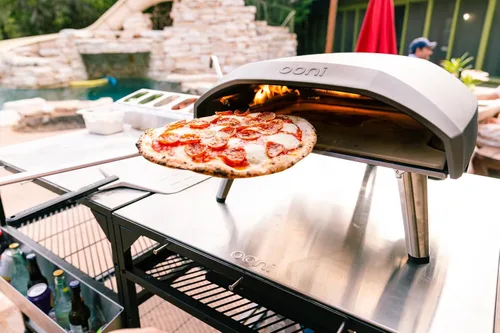 Miniatura 4 de ooni Pala Giratoria para Pizza - Pala para Pizza Perforada de Aluminio de 7 Pulgadas, Volteador de Pizza de Metal Ligero con Mango Largo