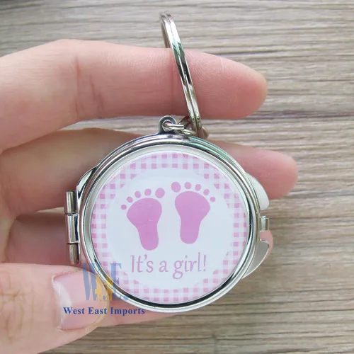 Miniatura 3 de 12 llaveros de espejo compacto para baby shower, con bolsa de organza, diseño de huella rosa