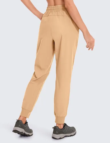 Miniatura 4 de CRZ YOGA Pantalones deportivos para mujer, impermeables, para exteriores, golf, atléticos, ligeros, con bolsillos con cremallera, de 27 pulgadas