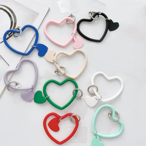 Miniatura 7 de Correa de silicona en forma de corazón para teléfono, correa de muñeca para teléfono celular con soporte para llavero, universal compatible con Negro