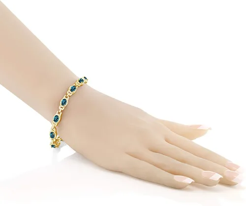 Miniatura 2 de Gem Stone King Pulsera de tenis ovalada de plata chapada en oro amarillo de 18 quilates con topacio azul Londres para mujer