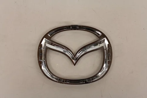 Miniatura 2 de Partes Originales de Mazda C235-51-731A Emblema de Logotipo Frontal