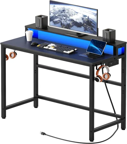 YATINEY Escritorio pequeño para computadora con estación de carga y luces LED, escritorio para juegos con soporte para monitor, escritorio de