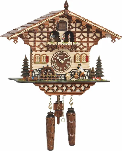 Trenkle Reloj de cuco de cuarzo, casa de la selva negra con picador de madera móvil y rueda de molino, con música TU 4212 QMT HZZG
