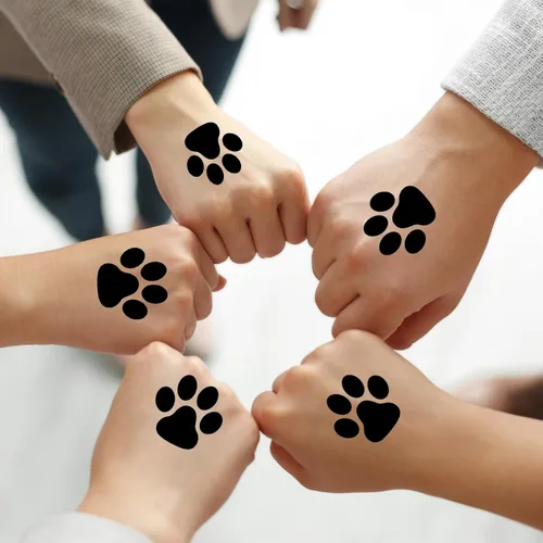 Miniatura 6 de Harloon 20 hojas de 300 tatuajes temporales de huellas de patas, tatuajes faciales para perros, calcomanías extraíbles para Cheer Patrol para Negro