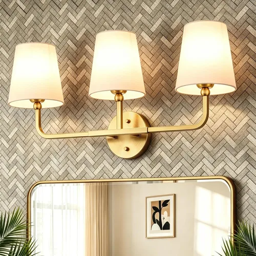 MOKATNG Lámparas de baño, 3 luces doradas cepilladas, accesorios de iluminación de baño sobre espejo con pantalla de tela blanca acampanada,