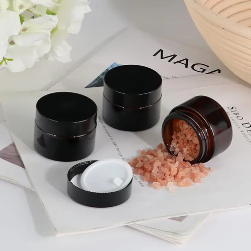 Miniatura 5 de Tarros de vidrio ámbar de 1 oz, paquete de 24 recipientes vacíos para cosméticos con tapas de rosca negras, tarros redondos recargables para loción