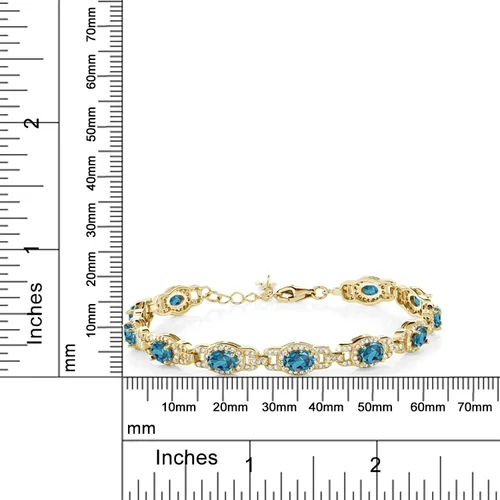 Miniatura 3 de Gem Stone King Pulsera de tenis ovalada de plata chapada en oro amarillo de 18 quilates con topacio azul Londres para mujer