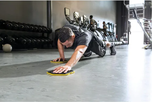 Miniatura 6 de SKLZ Slidez - Discos deslizantes de ejercicio de doble cara para ejercicios de estabilidad central para manos y pies, uso estándar, amarillo