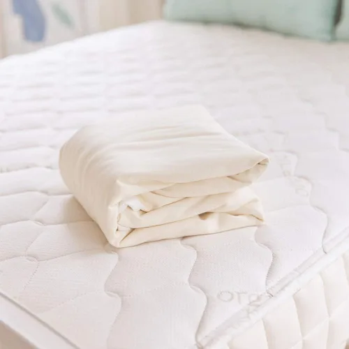 Miniatura 4 de Naturepedic Protector de colchón orgánico impermeable – Funda de colchón de punto elástico ajustable lavable y reutilizable – Almohadillas