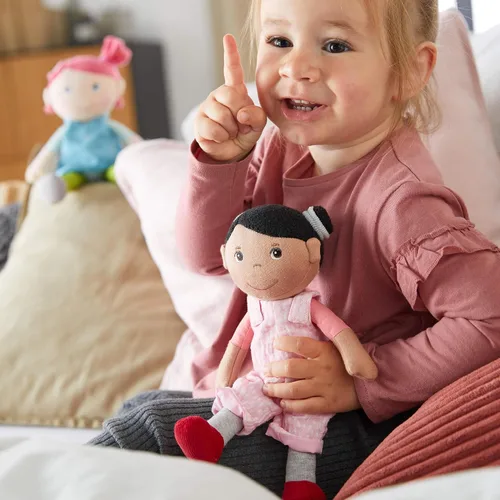 Miniatura 5 de HABA Snug Up Doll Rumbi - Muñeca suave de 10 pulgadas con cabello negro y overol rosa - Lavable a máquina para 18 meses en adelante