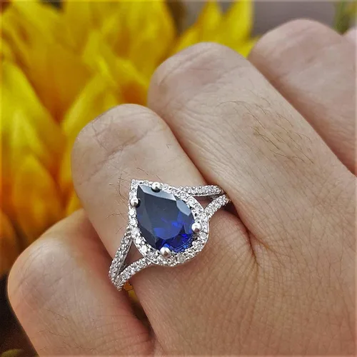 Miniatura 39 de Dazzlingrock Collection Anillo de compromiso con forma de lágrima y diamante blanco natural redondo de 0.45 quilates con halo de diamantes blancos