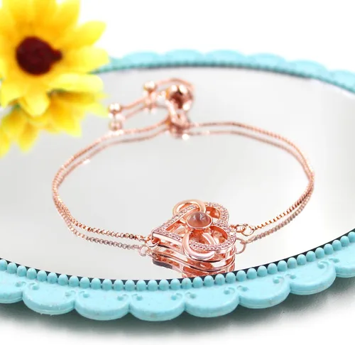 Miniatura 6 de Pulsera ajustable de cadena de plata/oro rosa, 4 dijes de corazón diferentes en 100 idiomas con texto en inglés "Say I Love You", pulsera