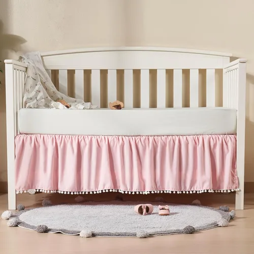 TILLYOU Falda de cuna de bebé para niñas y niños, falda de cama con volantes con pompones, 28 x 52 pulgadas, caída de 14 pulgadas, rosa
