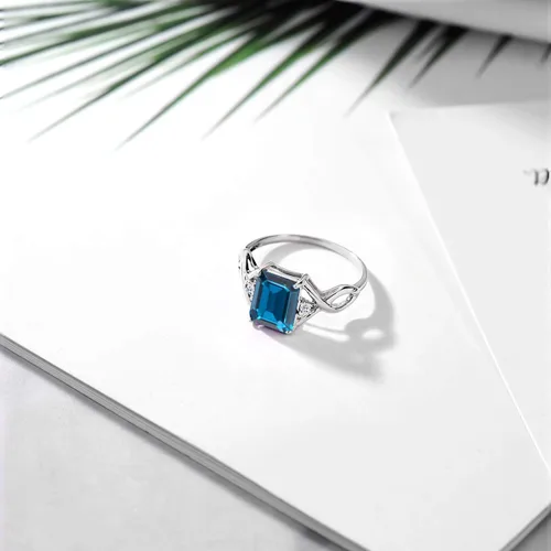 Miniatura 5 de Gem Stone King Anillo de compromiso de topacio azul Londres y topacio blanco de 2.75 quilates para mujer, plata de ley 925, corte esmeralda de 0.354