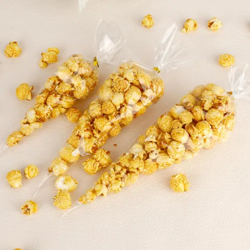 Miniatura 5 de 100 bolsas de golosinas en forma de cono – 11.8 x 6.3 pulgadas, triángulo con lazos, plástico transparente para palomitas de maíz, galletas, dulces