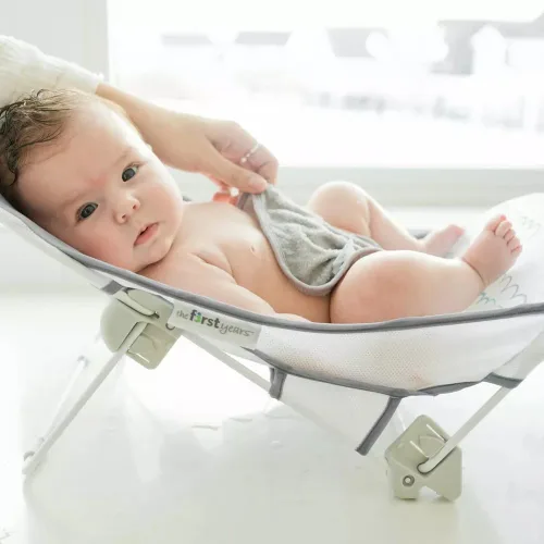 Miniatura 2 de The First Years Sure Comfort - Bañador plegable para bebé, asiento de baño y tumbona plegable para el hogar o sobre la marcha, para uso