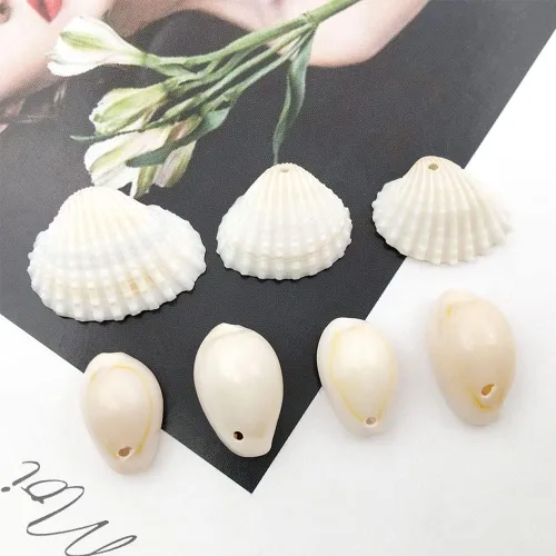 Miniatura 4 de 100 cuentas redondas y ovaladas blancas de 0.433 x 0.709 in, perfectas para joyas temáticas de playa de verano
