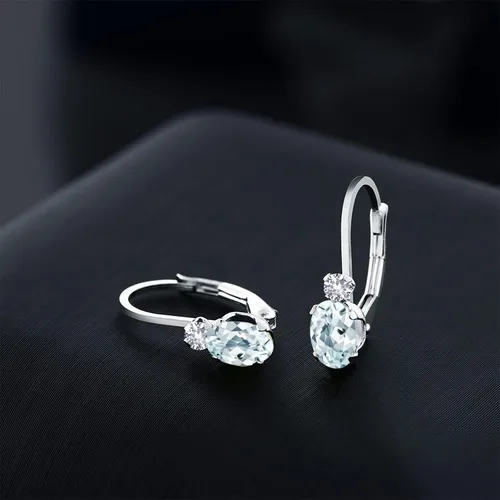 Miniatura 3 de Gem Stone King Aretes de oro blanco de 14 quilates con aguamarina azul cielo y zafiro blanco creado para mujer (0.94 qt ovalado 34 pulgadas), Metal
