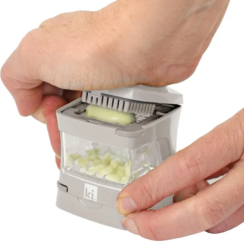 Miniatura 3 de Prensa de ajo Garlic-A-Peel, trituradora, cortadora, picadora y contenedor de almacenamiento - Incluye pelador de ajo de silicona - Fácil de limpiar