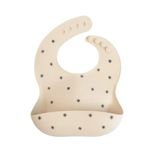 Mushie - Babero de silicona para bebé, ajustable y resistente al agua (margarita negra)