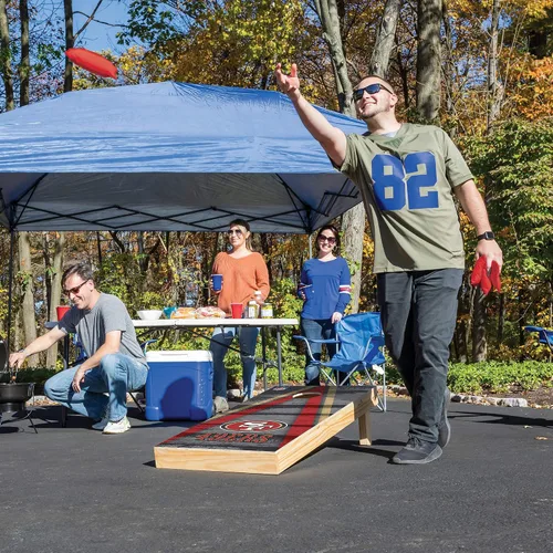 Miniatura 6 de Wild Sports - Set para jugar al cornhole (meter sacos pequeños en un agujero) con tablero de madera de 2 x 4 pies y 8 sacos con frijoles, diseño