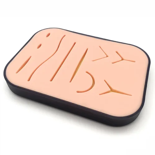 La almohadilla de sutura mejorada tiene 3 capas de silicona y 10 heridas, viene con una caja, difícil de rasgar, romper o rasgar. Regalos para