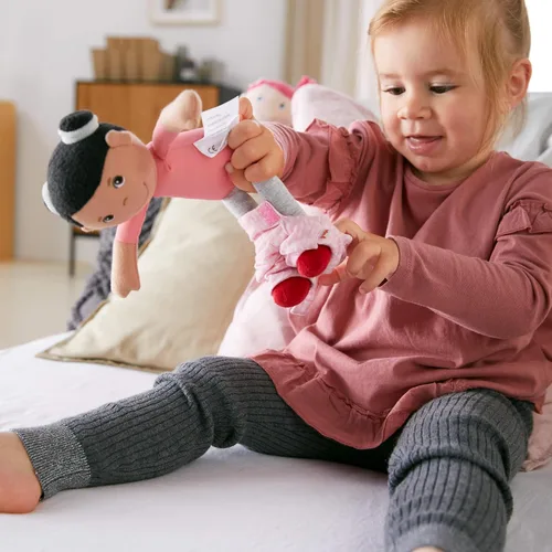 Miniatura 7 de HABA Snug Up Doll Rumbi - Muñeca suave de 10 pulgadas con cabello negro y overol rosa - Lavable a máquina para 18 meses en adelante