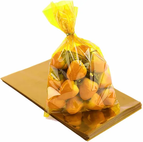 CC wonderland zone Bolsas de celofán amarillas – Paquete de 50 bolsas de plástico de celofán de regalo con lazos, para dulces de galletas, regalos