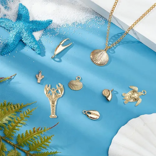Miniatura 5 de SUNNYCLUE 1 caja de 1.90 oz de dijes chapados en oro real de 14 quilates a granel de oro de verano de océano, 16 piezas de dijes de vida marina